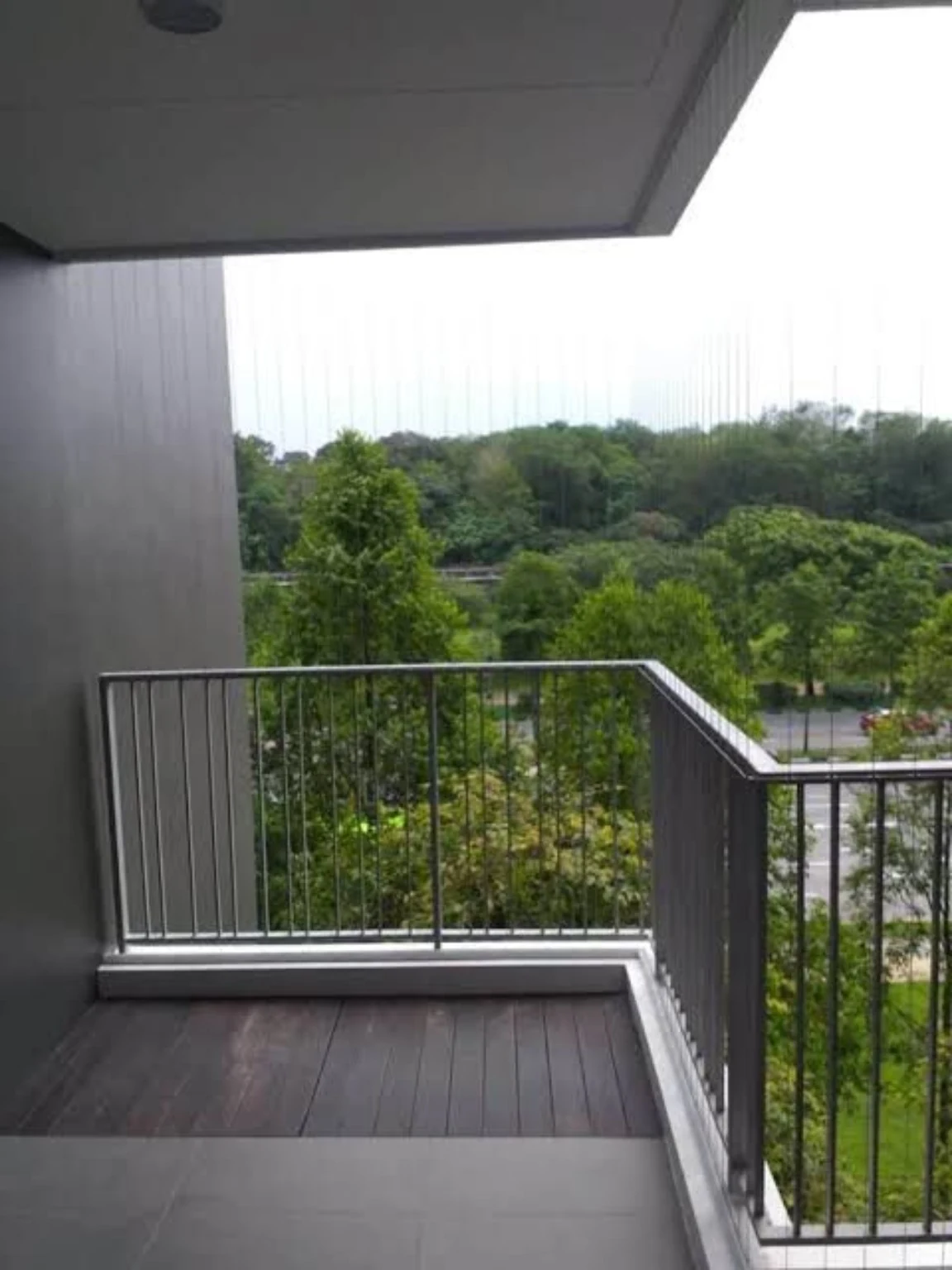 Balcony safety cables installed with an open green view
