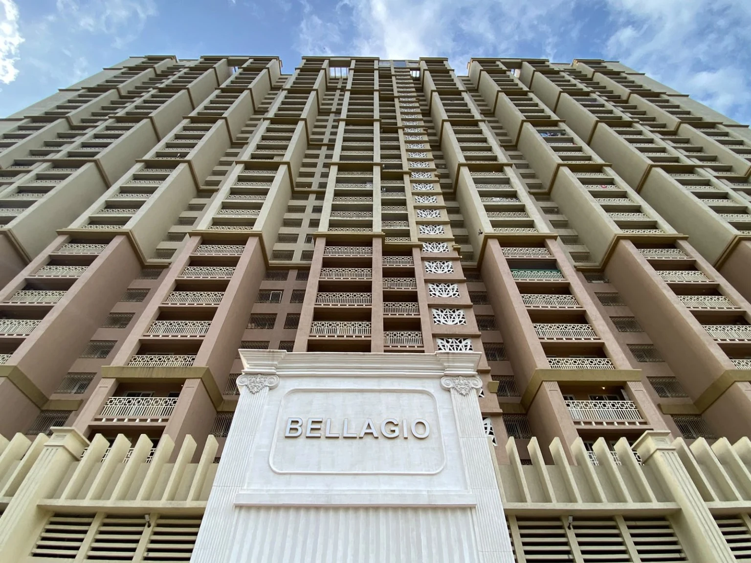 Bellagio residential high-rise exterior with balcony safety grilles