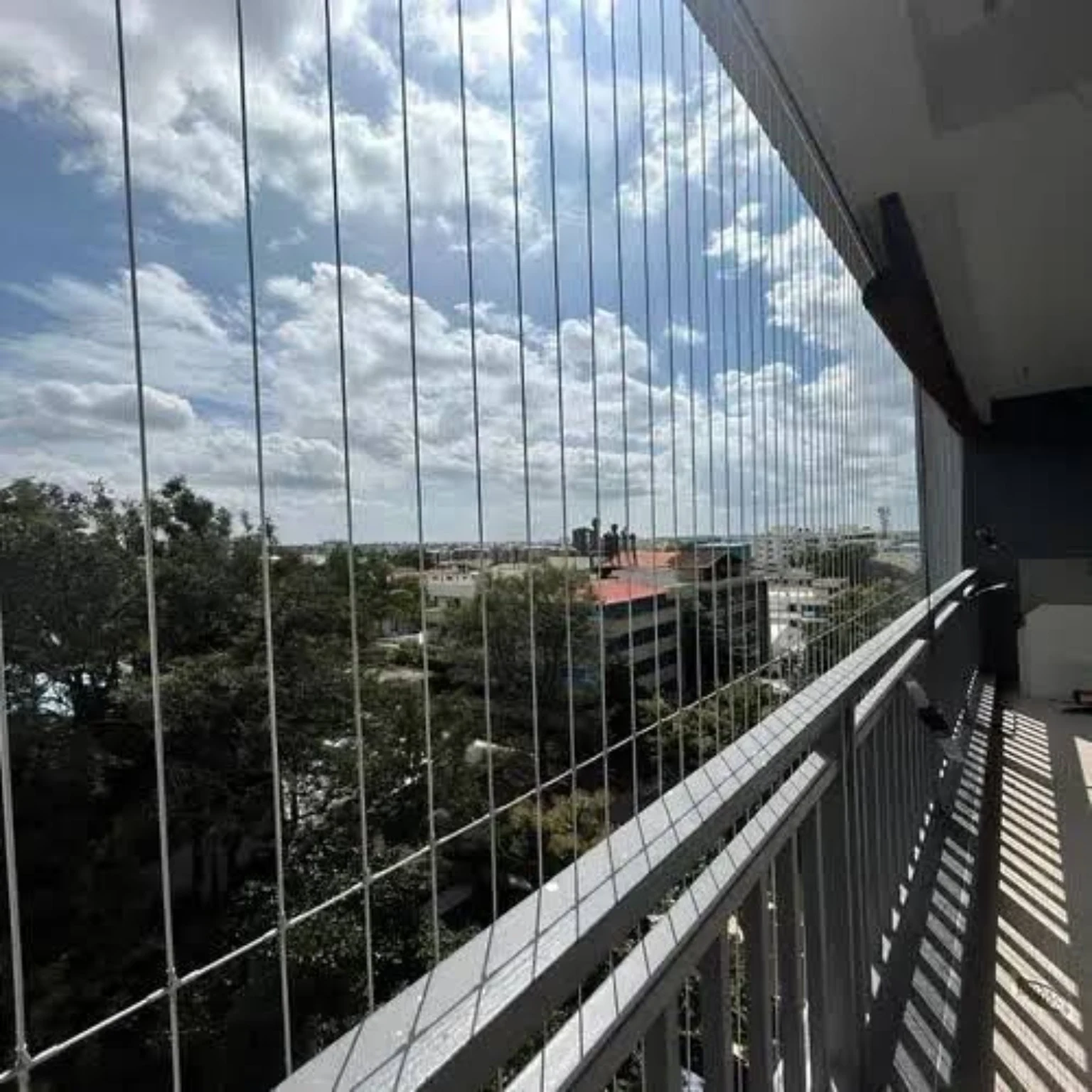 Invisible grill installation preserving an open daytime city view