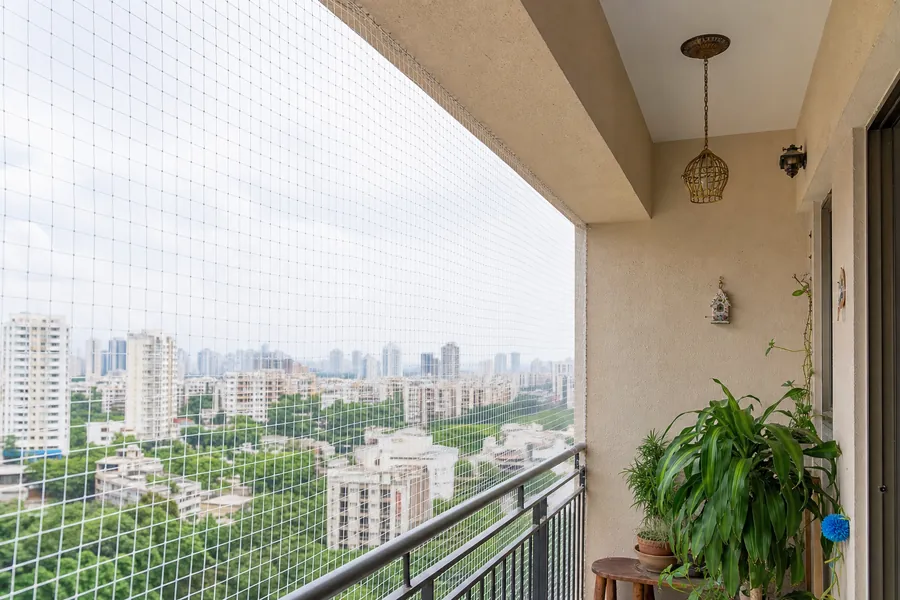 Bird protection net installation on Mumbai apartment balcony